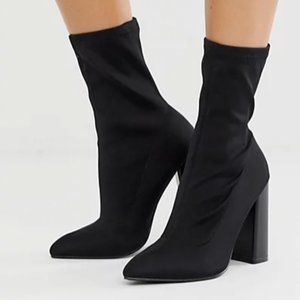 Slick high heeled sock boot